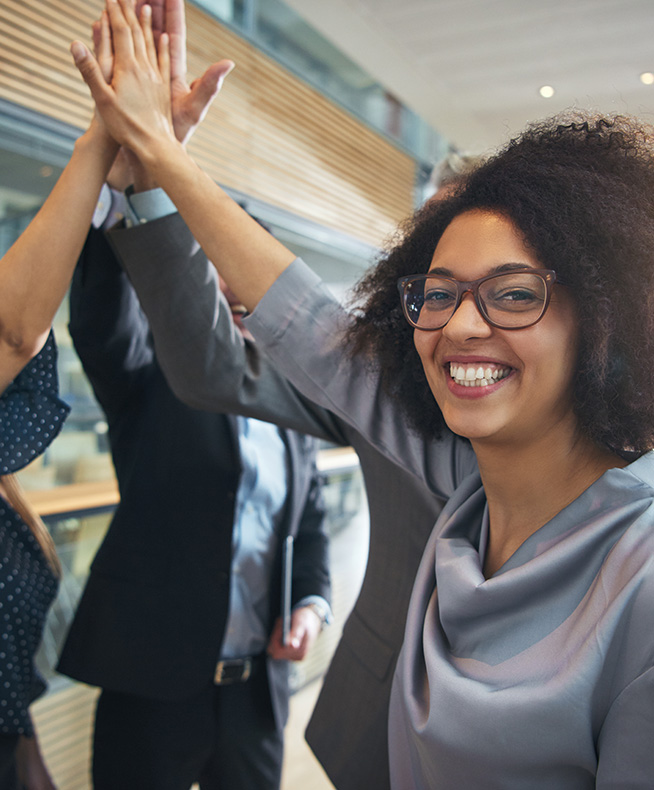 business collegues doing a high-five